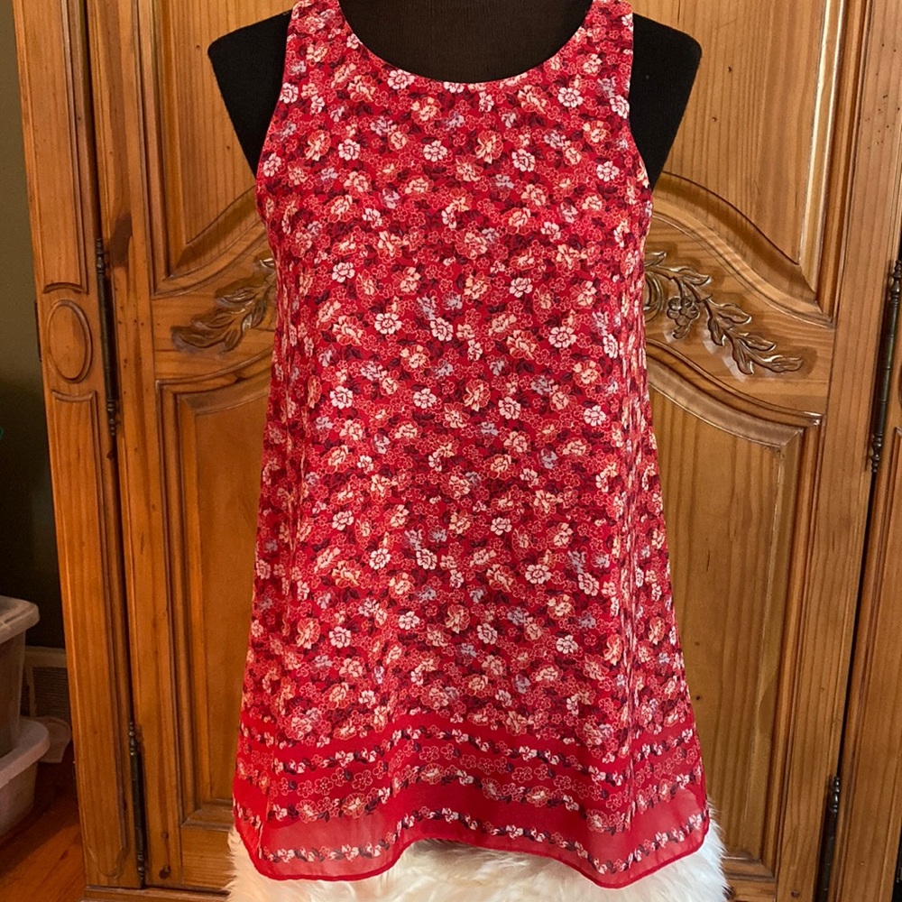 Max studio red with floral print(see photo). Hanky hem and keyhole button back.